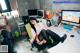 A woman sitting at a desk in front of a computer.